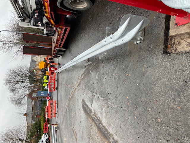 Armco barrier protecting a wall and service area