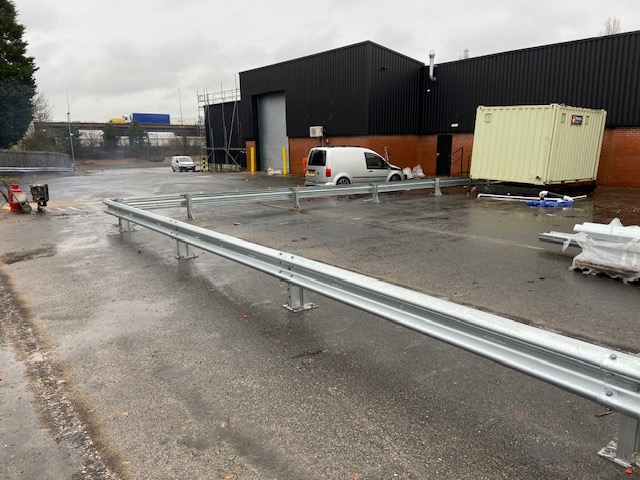 Armco safety barrier beside a traffic route