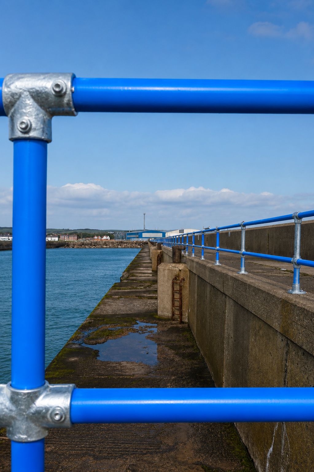Dockside tubular handrail guarding an exposed edge