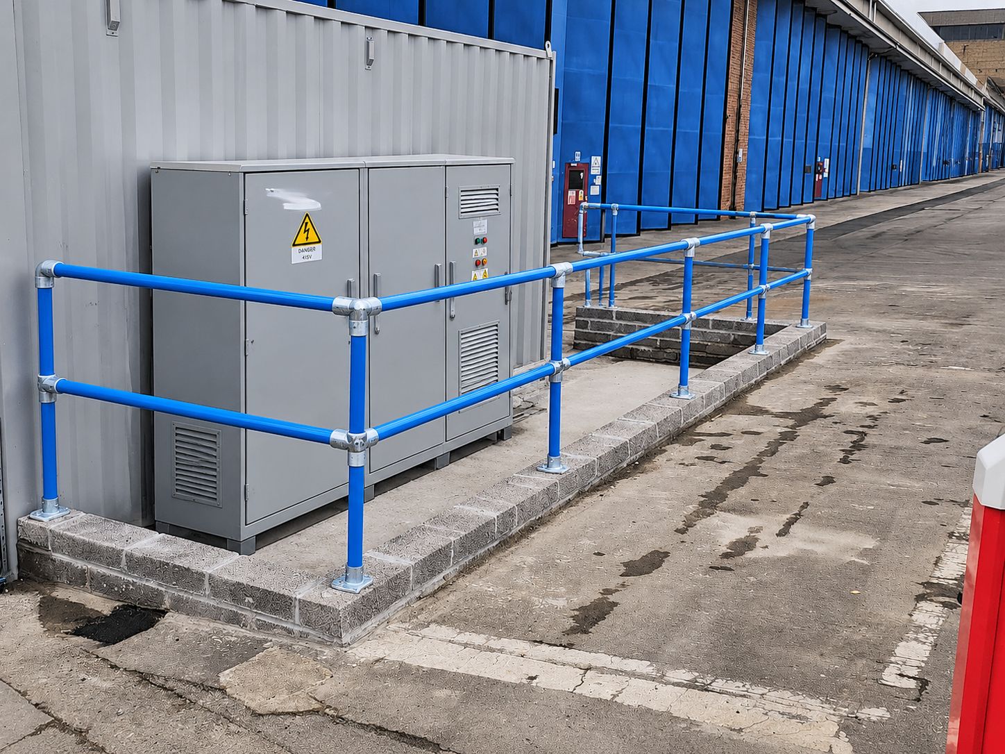Protective guardrail around an electrical cabinet